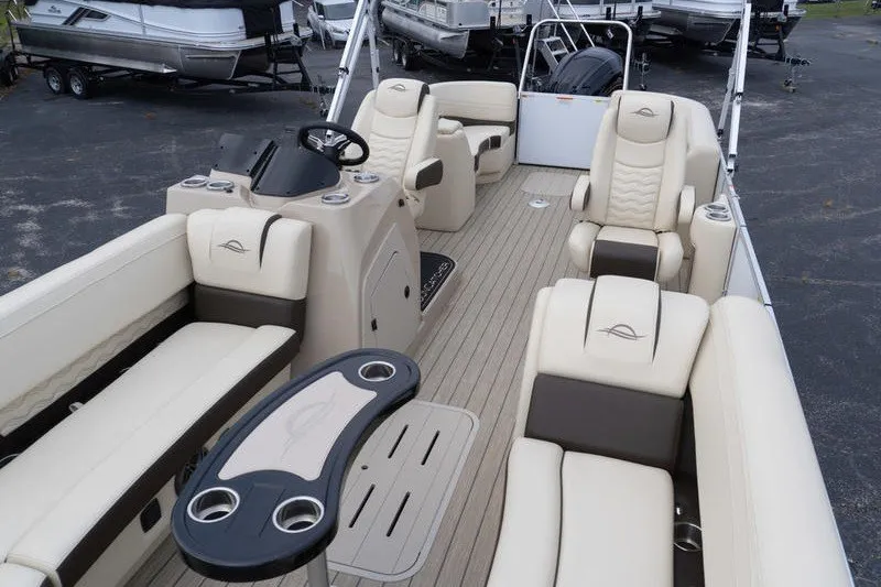 Slide: The Image of Luxurious 2026 SunCatcher Fusion 324RC pontoon boat interior with plush seating and sleek design. - 23