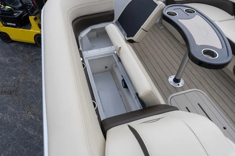 Slide: The Image of Luxurious SunCatcher Fusion 324RC boat interior with beige seating and storage compartments, 2026 model. - 18