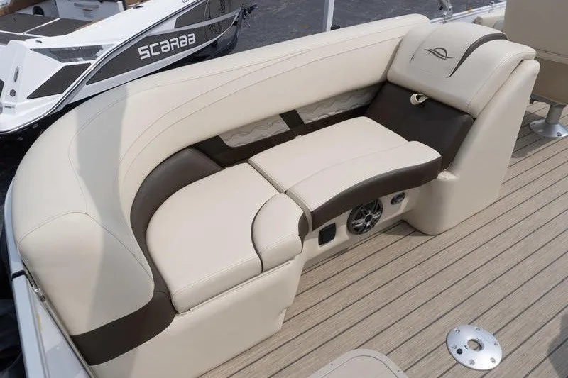Slide: The Image of Luxurious seating on 2026 SunCatcher Fusion 324RC boat, featuring beige and brown upholstery. - 30