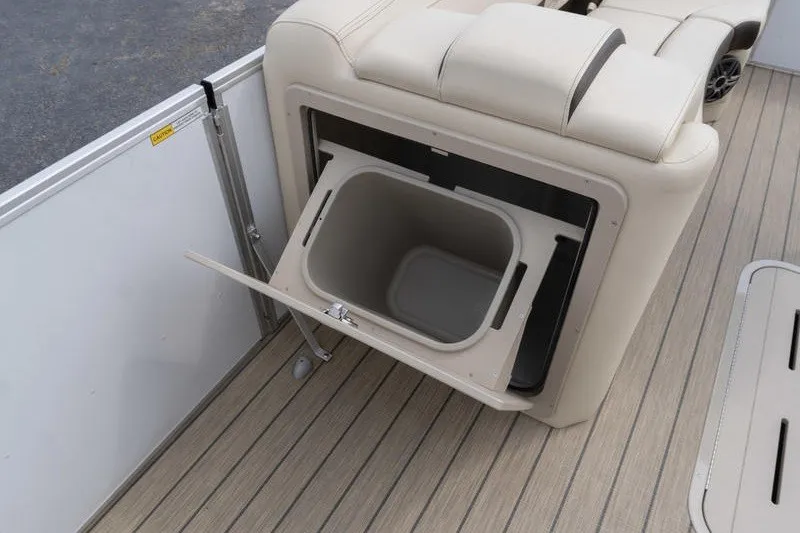 Slide: The Image of SunCatcher Fusion 324RC 2026 boat interior with built-in storage compartment. - 14