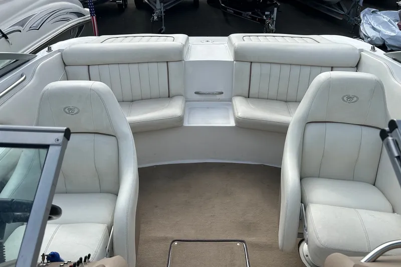 Slide: The Image of Interior of a 2008 Cobalt 200 boat with white leather seating and carpeted floor. - 13