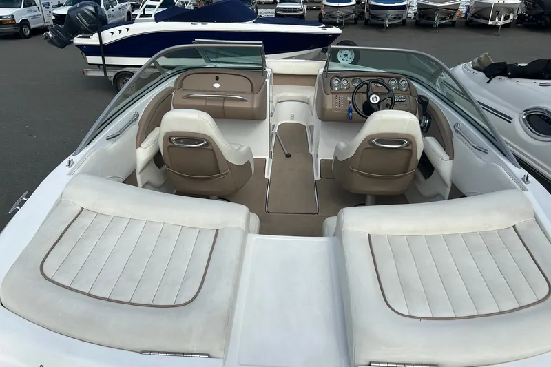 Slide: The Image of Interior of a 2008 Cobalt 200 boat with white and beige seating. - 15