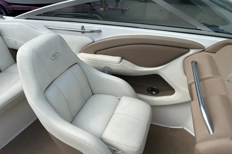 Slide: The Image of Interior of a 2008 Cobalt 200 boat with beige and white seating. - 17