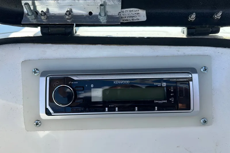 Slide: The Image of Kenwood stereo system in a 2001 Tige 22i boat dashboard. - 16