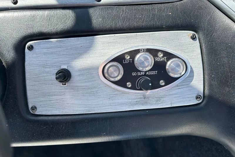 Slide: The Image of Control panel of a 2001 Tige 22i boat with Go Surf Assist feature. - 17