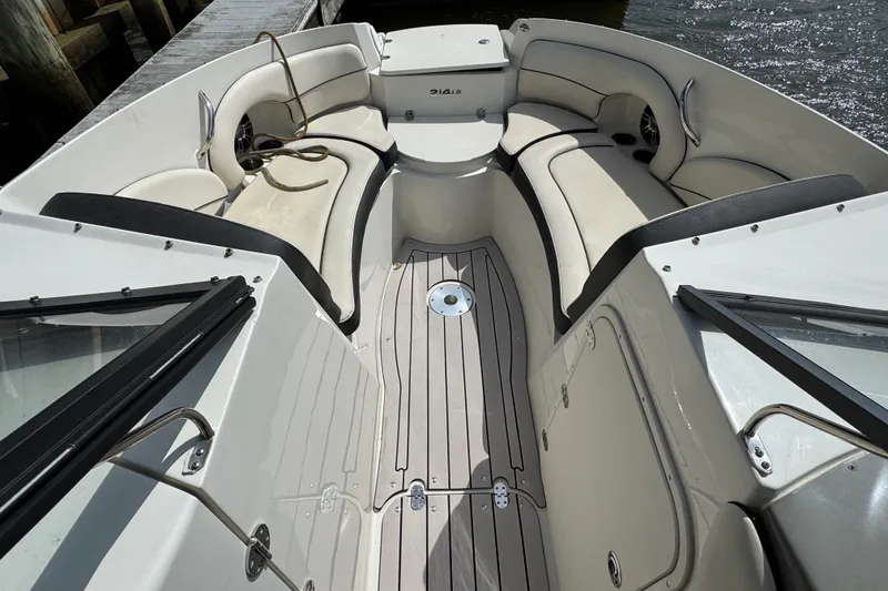 Slide: The Image of 2021 Stingray 214 LR boat interior with spacious seating and sleek design. - 15