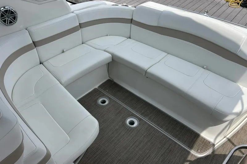 Slide: The Image of 2016 Formula 31 Performance Cruiser interior seating with beige and white upholstery. - 12