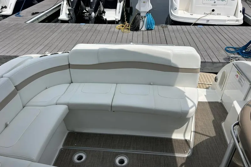 Slide: The Image of 2016 Formula 31 Performance Cruiser with white seating at a marina dock. - 11