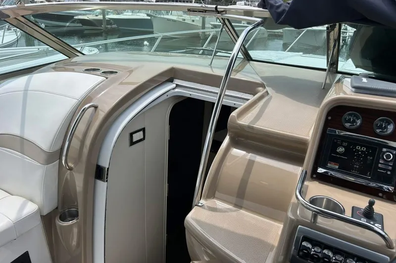 Slide: The Image of 2016 Formula 31 Performance Cruiser cockpit with helm, seating, and cabin entrance. - 18