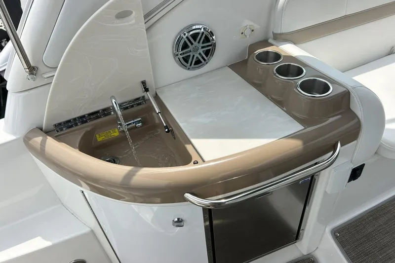 Slide: The Image of 2016 Formula 31 Performance Cruiser wet bar with sink and cup holders. - 15