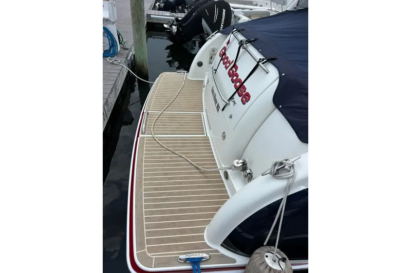 Slide: The Image of 2016 Formula 31 Performance Cruiser docked, featuring a sleek swim platform. - 3