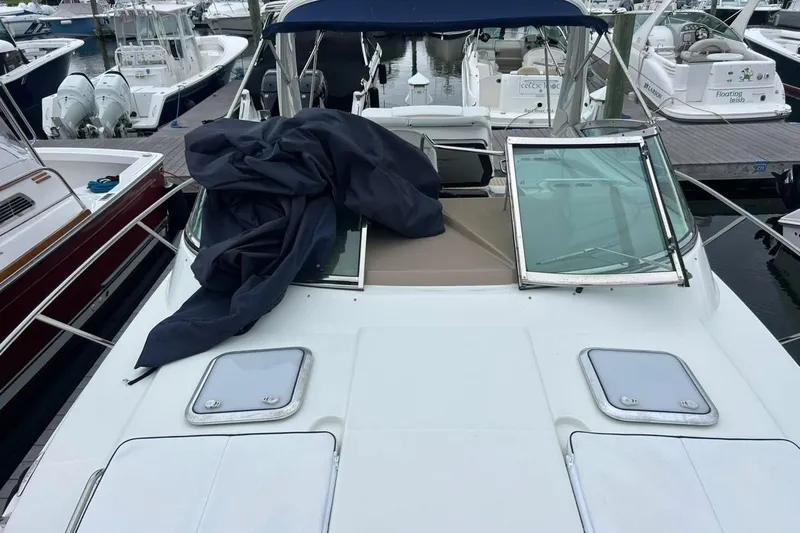 Slide: The Image of 2016 Formula 31 Performance Cruiser docked, featuring a covered deck and open windshield. - 5
