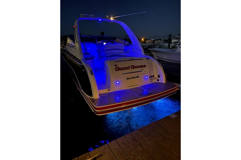 Slide: The Image of 2016 Formula 31 Performance Cruiser with blue LED lights at night docked. - 27