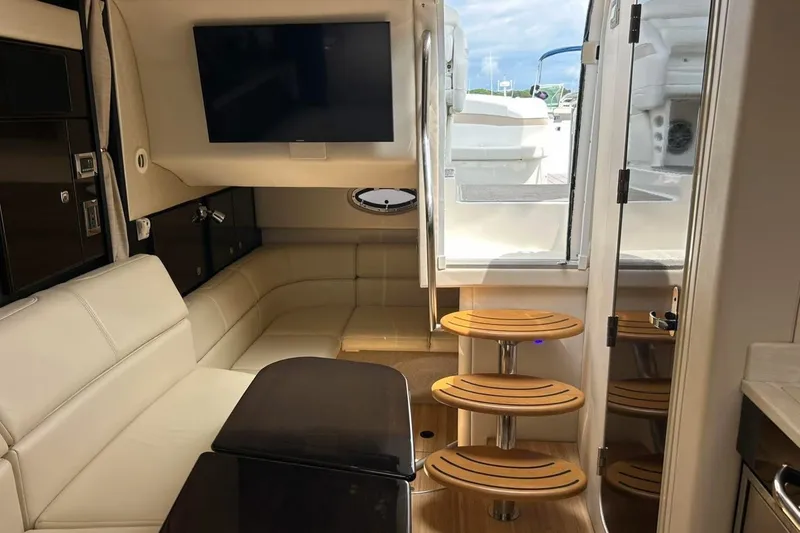 Slide: The Image of Interior of 2016 Formula 31 Performance Cruiser with modern seating and wooden steps. - 19