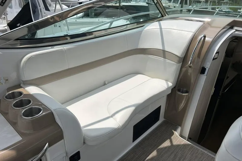 Slide: The Image of 2016 Formula 31 Performance Cruiser interior with white seating and cup holders. - 10