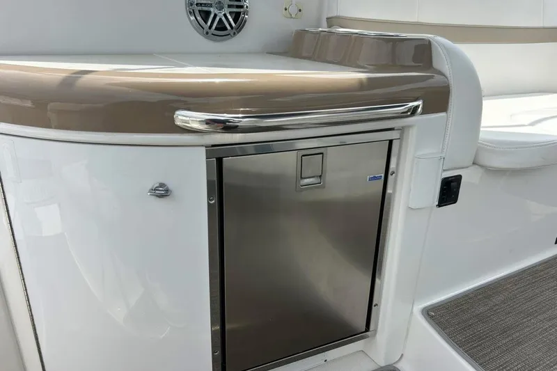 Slide: The Image of 2016 Formula 31 Performance Cruiser interior with stainless steel fridge and seating area. - 14