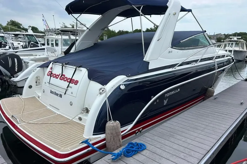 Slide: The Image of 2016 Formula 31 Performance Cruiser docked at marina, covered and ready for sailing. - 1