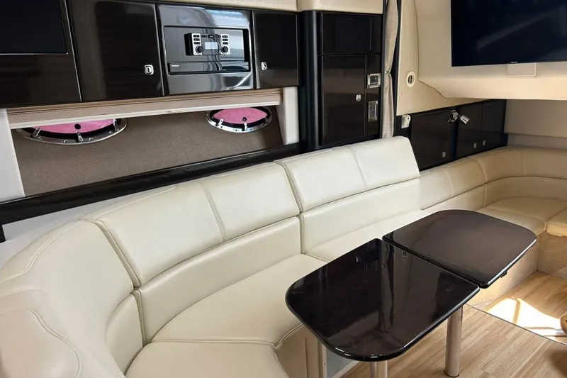 Slide: The Image of Luxurious interior of a 2016 Formula 31 Performance Cruiser with cream leather seating and dark wood accents. - 21