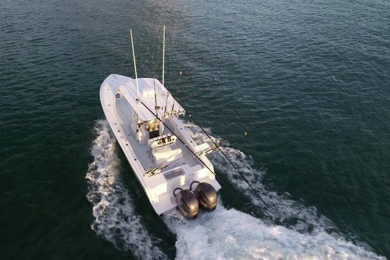 Slide: The Image of Aerial view of 2026 Contender 25 Tournament boat cruising on open water. - 4