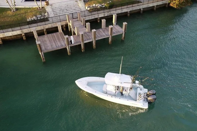 Slide: The Image of Aerial view of 2026 Contender 25 Tournament boat near a wooden dock. - 6