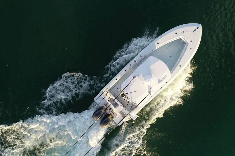 Slide: The Image of Aerial view of 2026 Contender 25 Tournament boat cruising on water. - 7