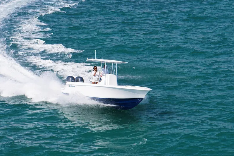 Slide: The Image of 2026 Contender 25 Tournament boat cruising on open water. - 2