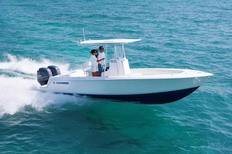 Slide: The Image of 2026 Contender 25 Tournament boat cruising on clear blue ocean waters. - 1
