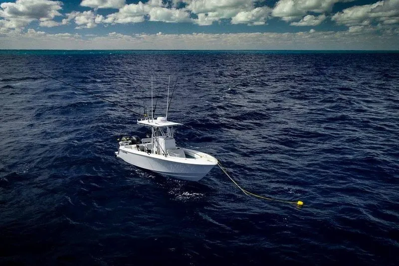 Slide: The Image of 2026 Contender 25 Tournament boat on open ocean under cloudy sky. - 5