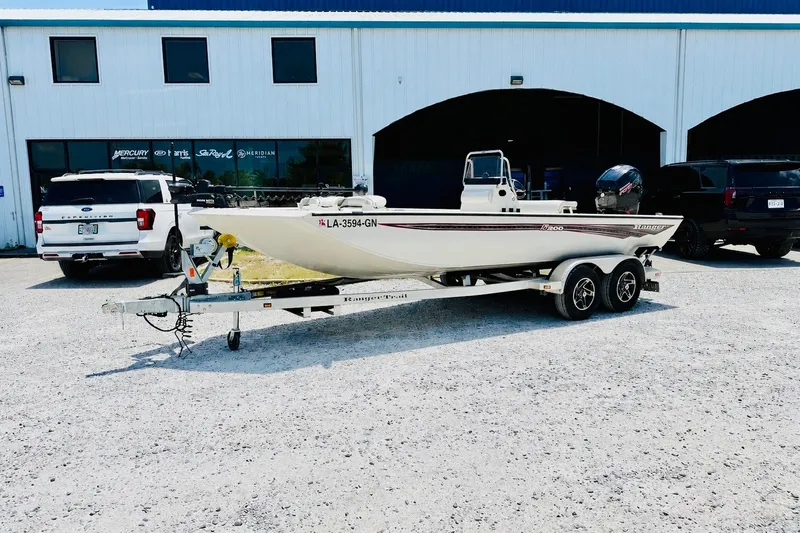 The Image of 2021 Ranger RB200 boat on trailer in front of dealership. - 0