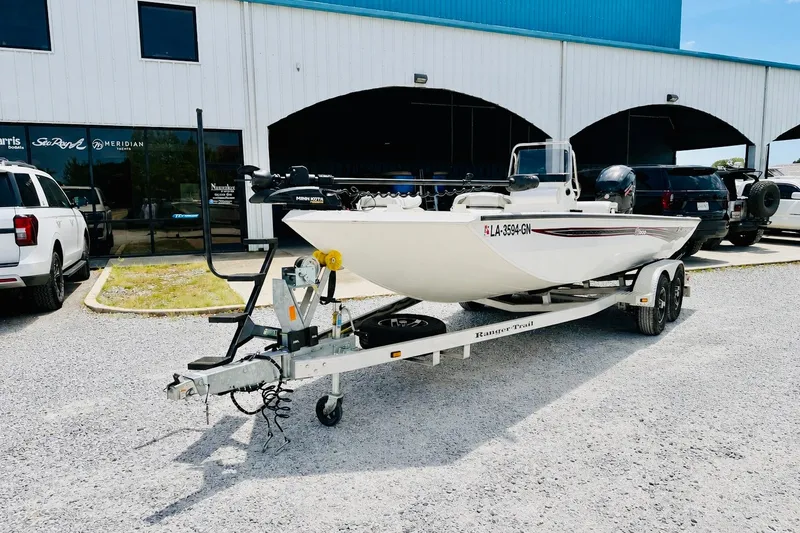 Slide: The Image of 2021 Ranger RB200 boat on trailer outside dealership. - 1