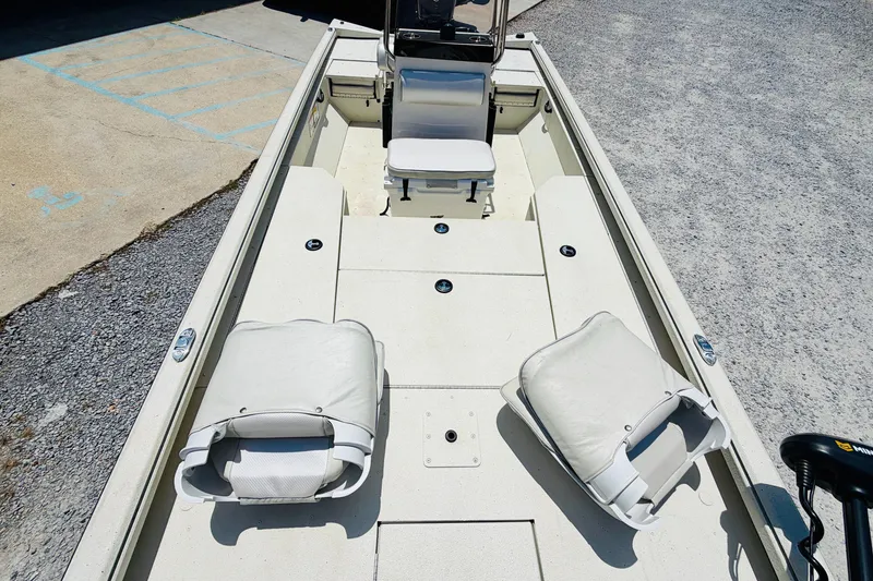 Slide: The Image of 2021 Ranger RB200 boat interior with white seating and spacious deck layout. - 9