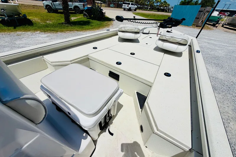 Slide: The Image of 2021 Ranger RB200 boat interior with cushioned seating and storage compartments. - 13