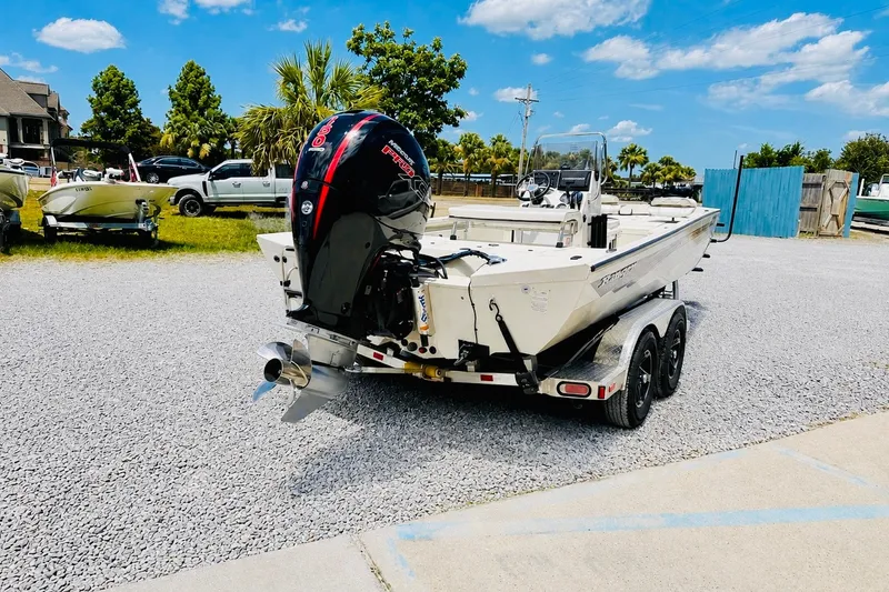 Slide: The Image of 2021 Ranger RB200 boat on trailer with powerful outboard motor, parked outdoors. - 3