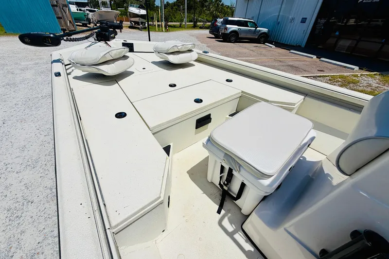 Slide: The Image of 2021 Ranger RB200 boat interior with cushioned seating and storage compartments. - 12