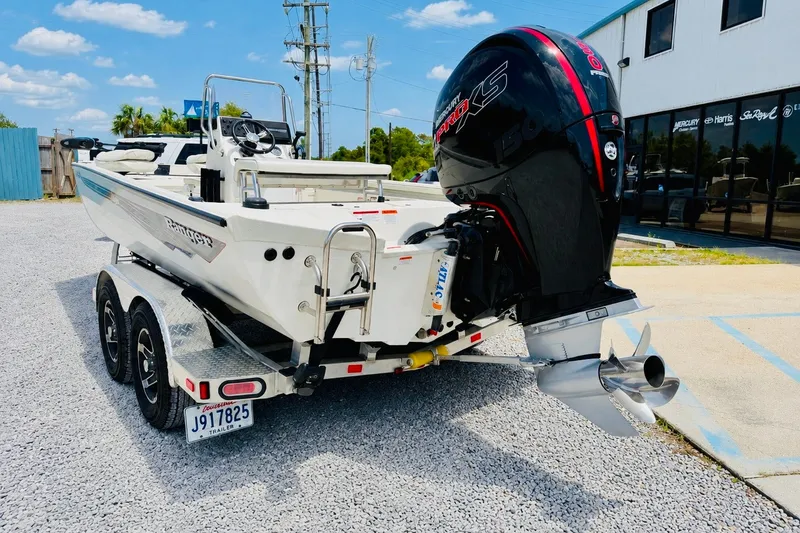 Slide: The Image of 2021 Ranger RB200 boat with Mercury Pro XS engine on a trailer. - 2
