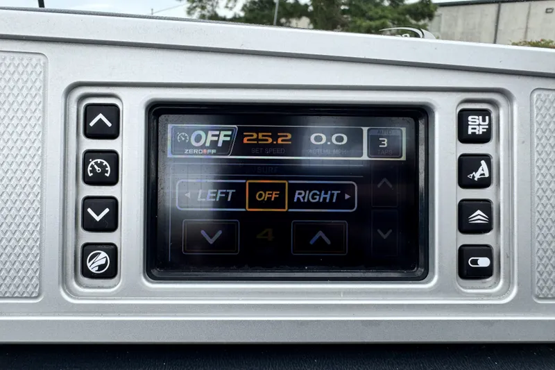 Slide: The Image of 2017 Tigé R23 boat control panel displaying speed and surf settings. - 18