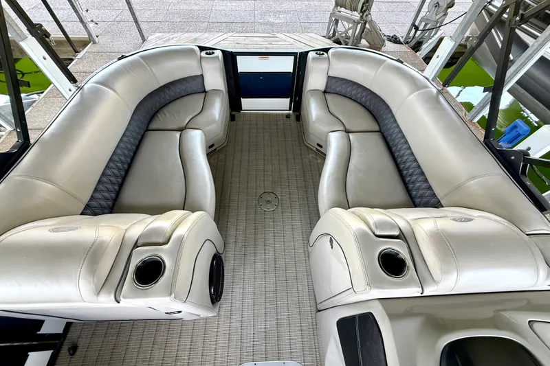 Slide: The Image of Luxurious seating on a 2019 Barletta L23QC SS pontoon boat, featuring plush leather upholstery. - 36