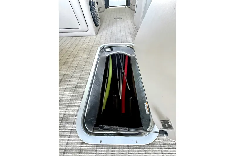 Slide: The Image of 2019 Barletta L23QC SS boat interior storage compartment with open hatch. - 39