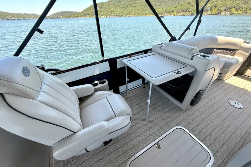 Slide: The Image of Luxurious interior of 2019 Barletta L23QC SS pontoon boat with comfortable seating and table. - 21
