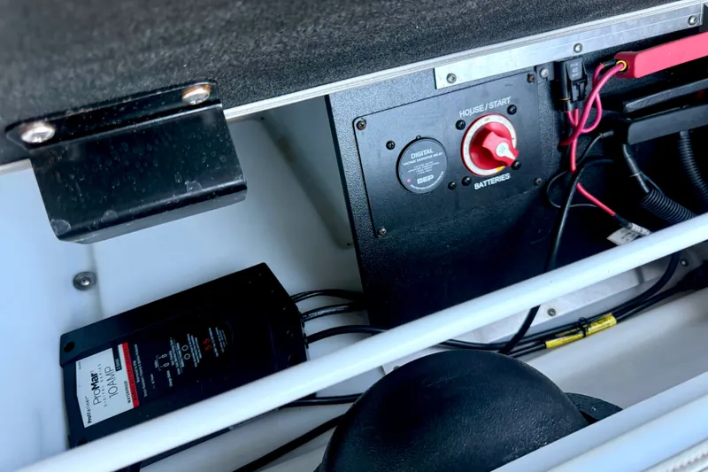 Slide: The Image of Battery compartment of a 2019 Barletta L23QC SS boat with control panel and wiring. - 30