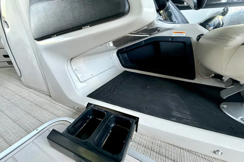 Slide: The Image of Interior of 2019 Barletta L23QC SS boat with cup holders and seating area. - 38