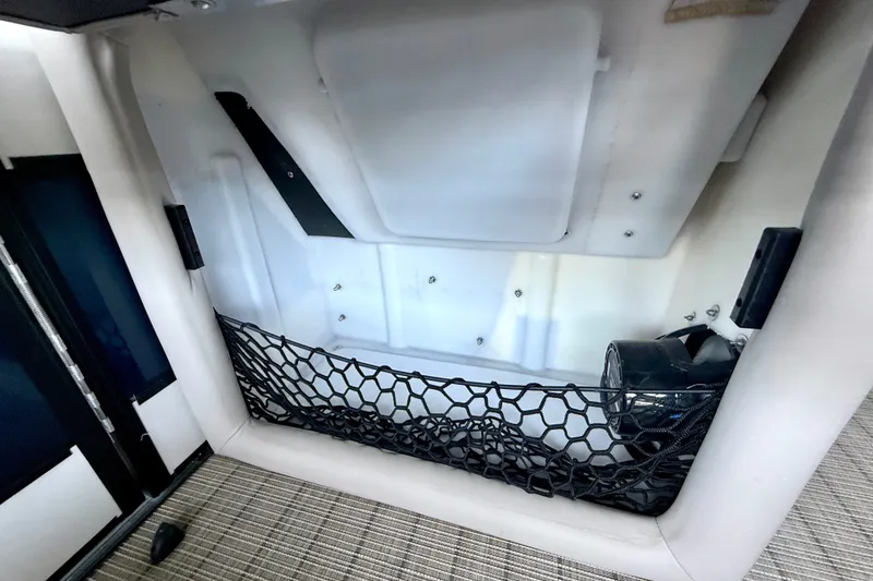 Slide: The Image of 2019 Barletta L23QC SS storage compartment with netting and speaker. - 33