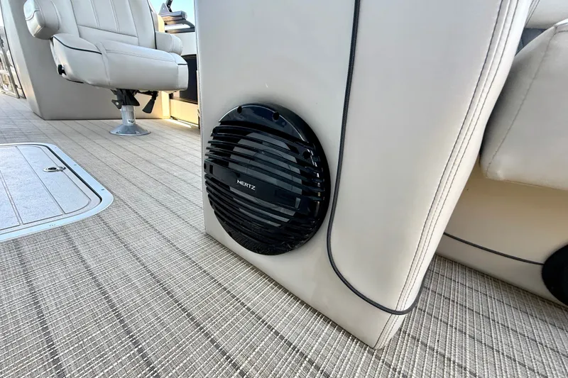 Slide: The Image of 2019 Barletta L23QC SS boat interior with speaker and seating detail. - 27
