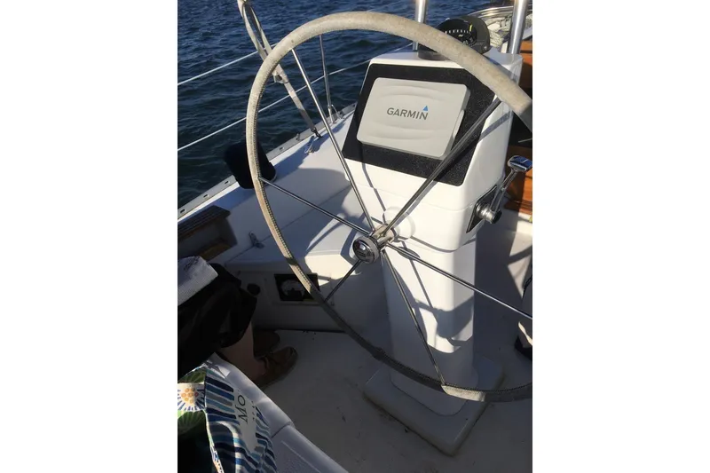 Slide: The Image of Steering wheel of a 1987 Hunter 31 sailboat with Garmin navigation system. - 3