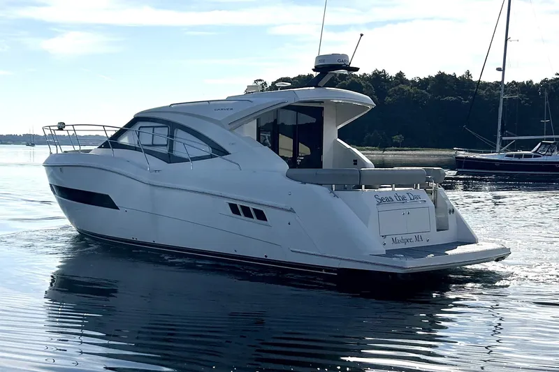 Slide: The Image of 2019 Carver C37 yacht cruising on calm waters, featuring sleek design and modern amenities. - 8