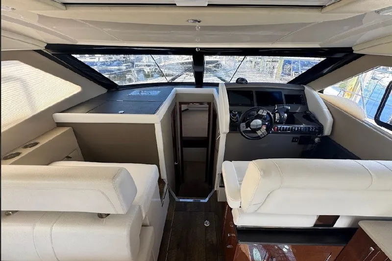 Slide: The Image of Interior of 2019 Carver C37 yacht with modern helm and seating area. - 18