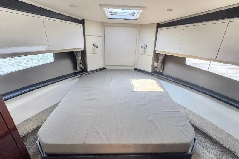 Slide: The Image of Luxurious interior cabin of 2019 Carver C37 yacht with spacious bed and modern design. - 24