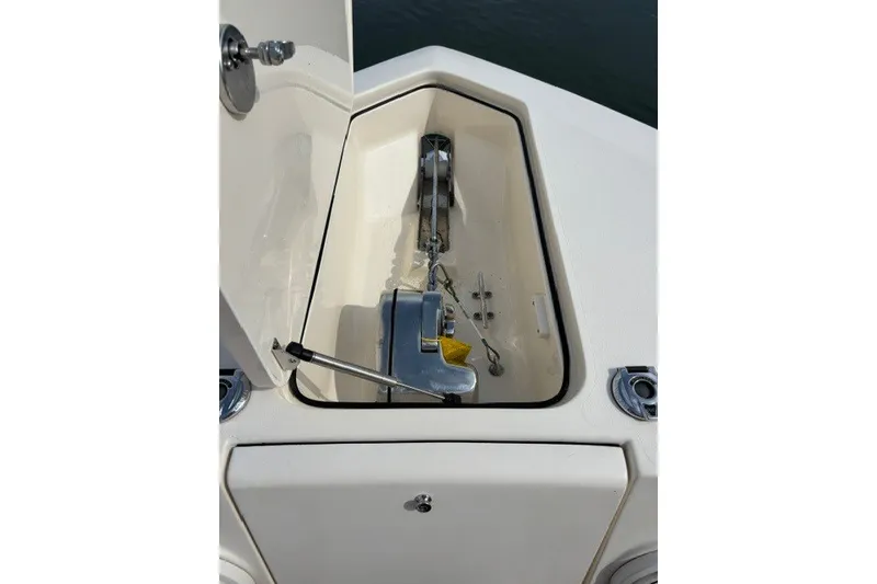 Slide: The Image of 2021 Scout 255 LXF boat anchor compartment with open hatch. - 4