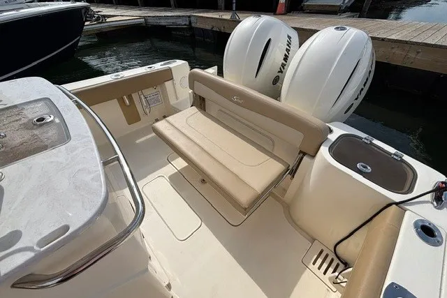 Slide: The Image of 2021 Scout 255 LXF boat interior with Yamaha engines and seating area. - 14