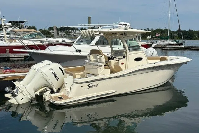 Slide: The Image of 2021 Scout 255 LXF boat docked with Yamaha outboard engine. - 1